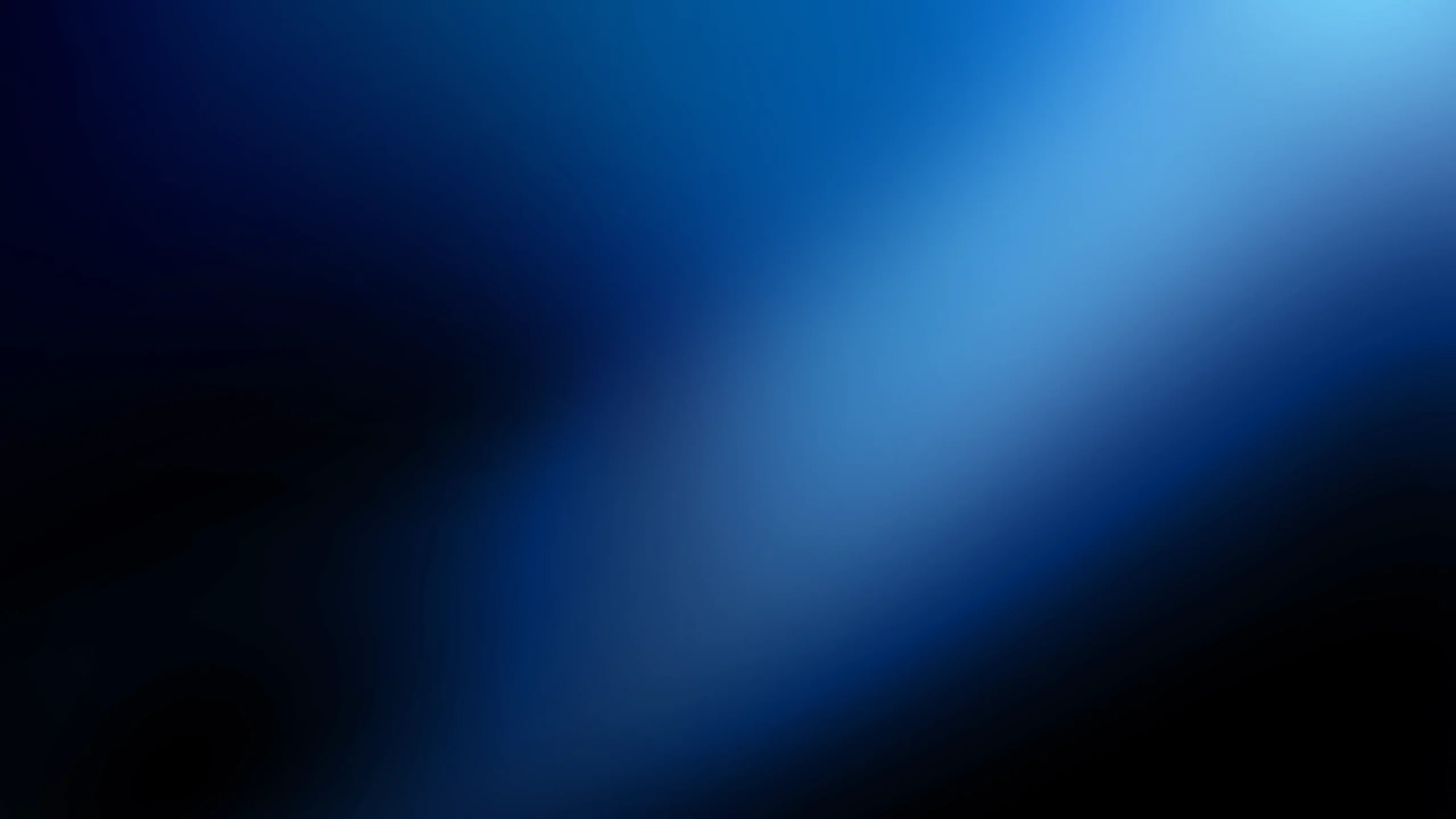 A blurred abstract background with gradients of blue and black, featuring a diagonal streak of lighter blue across the image.